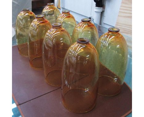 LAMP SHADES, a set of eight, in orange hand blown bubbled glass, 37cm H. (8)