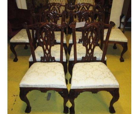 DINING CHAIRS, a set of eight, in Chippendale style with carved mahogany showframes and cream damask seats. (8)