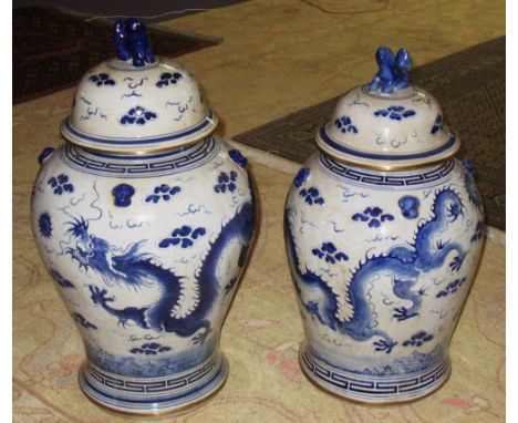 VASE, Chinese blue and white ceramic with cover, 61cm H and a smaller similar vase, 56cm H. (2)