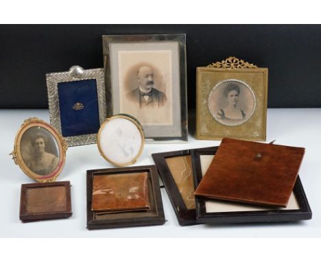 A collection of antique and vintage photograph frames to include two fully hallmarked silver examples. 