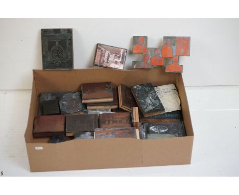 A collection of vintage printing blocks to include buildings, people, coats of arms....etc.. 