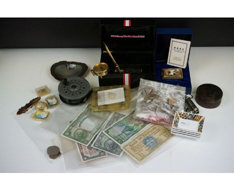 A box of mixed collectables to include A Halcyon Days enamel box, banknotes, coins, whistles, fishing flies and reel...etc. 