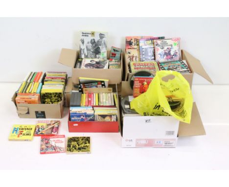 A large collection of vintage mainly Super 8 movie reels contained within five boxes. 