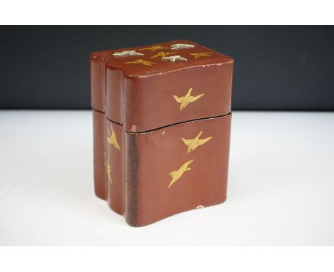 Japanese Red Laquered Playing Card Box  decorated with gilded and applied birds, the lift off lid opening to two compartments