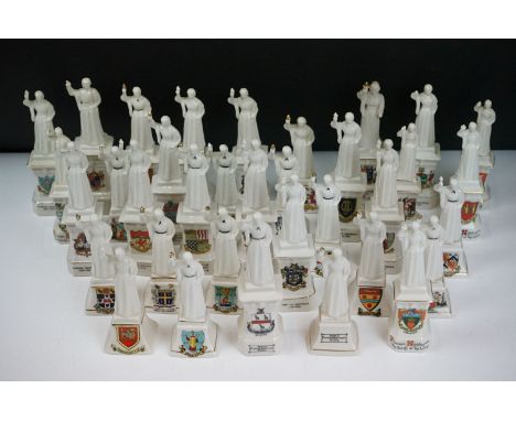 35 ceramic crested ware / goss figurines of Florence Nightingale, each with a town crest to the front. Tallest measures 18cm 