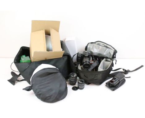 A Canon D40 Digital SLR / DSLR camera together with accessories to include lenses, flash, batteries, power winder...etc, cont