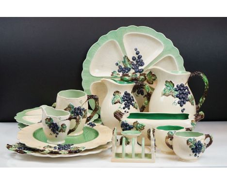 Carlton Ware - 1930's Grape pattern ceramics to include three jugs, Hors d'oeuvre platters, mugs, toast rack and candlestick.