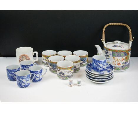 20th Century Japanese tea set having printed decoration to the sides including tea pot and six cups, red character marks to b