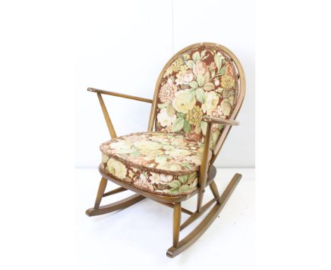 Mid century Retro Ercol Beech wood Hoop and Spindle back Rocking Armchair, with floral pattern upholstered seat cushions, 71c