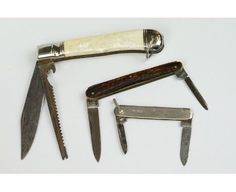 A collection of three vintage pocket knives to include a hallmarked silver cased example. 