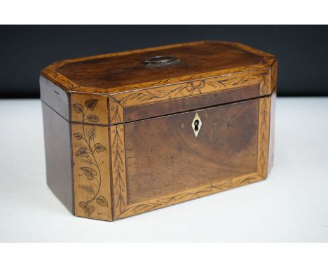 19th Century mahogany tea caddy having walnut borders with garland detailing opening to reveal two lead lined lidded compartm
