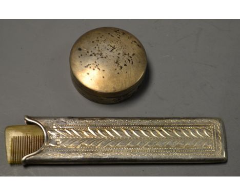 A Goldsmiths and Silversmiths patch box, London 1870; a horn comb in silver case, Birmingham 1897 (2)