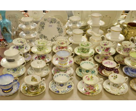 A set of twelve Royal Albert floral printed months of the year teacups and saucers; a Royal Albert Silver Maple tea set, comp