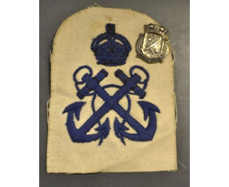 A minesweeper and anti submarine sleeve patch and silver badge