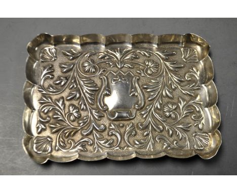 A Victorian silver shaped rectangular dressing table trinket tray, Mappin & Webb, London 1898
