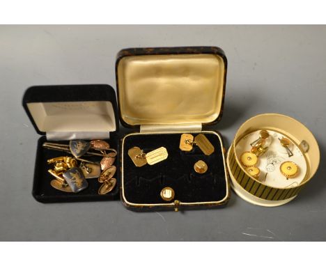 A pair of 9ct gold engine turned cuff links, collar studs en suite, 7g; a pair of Siam silver cuff links and similar tie clip