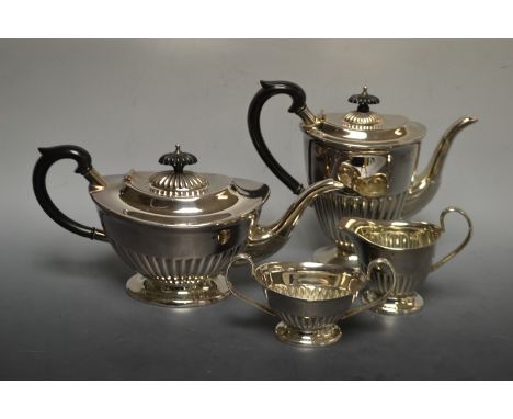 A Sheffield silver plated tea and coffee service, comprising tea pot, coffee pot, milk jug and two-handled sucrier, fluted, e