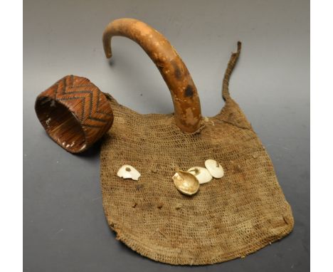 Tribal Art - a Papua New Guinea penis sheath, 21cm long; a bag, applied with shells; a woven cane bangle (3)

Provanance: Ron