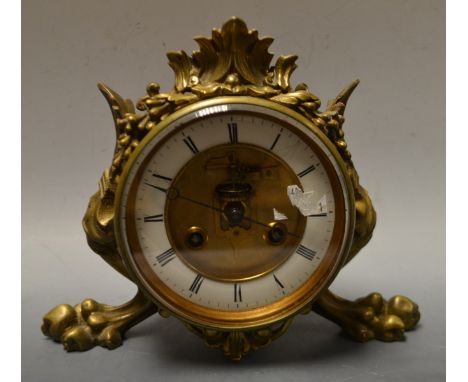 A Victorian brass striking drum clock, white enamel dial, Roman numerals, Marti , Paris movement, stylized feet, stamped Y N 