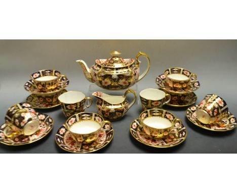 A Royal Crown Derby Imari palette 2451 pattern tea set for six, teapot, milk jug; four teacups and two saucers similar