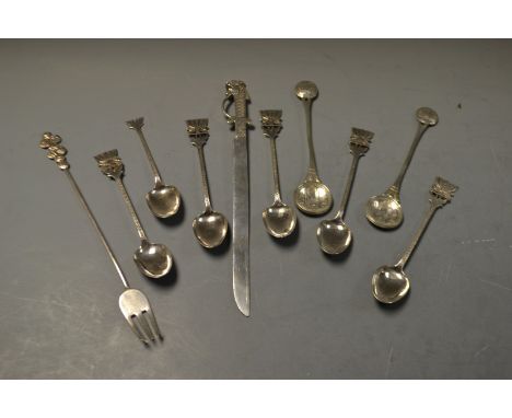 An Indian silver sword penknife; teaspoons; coin spoons; fork