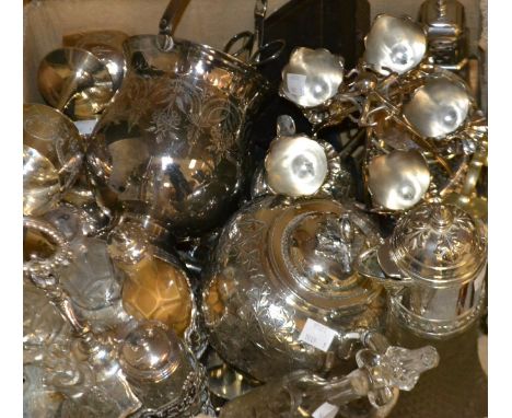 A late Victorian silver plated six bottle cut glass condiment stand; a globular EPNS teapot; an egg stand; claret jug; sugar 