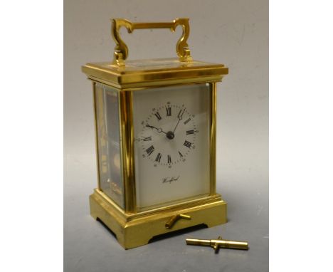 A Woodford lacquered brass carriage clock, five bevelled glass panels, 11 Jewels
