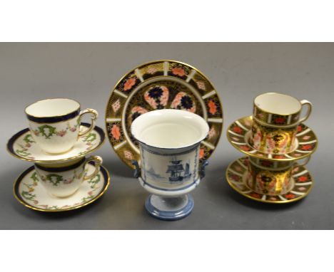 Royal Crown Derby - a pair of 1128 Imari coffee cans and saucers, a side plate;  a painted urn, decorated with a sailing boat