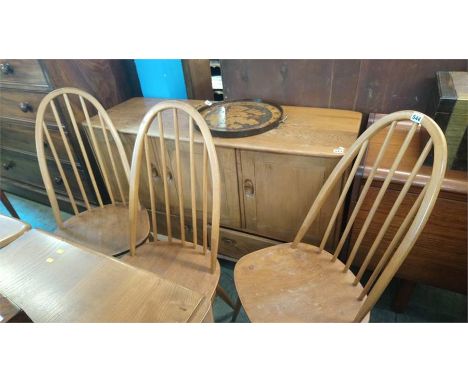 A set of four Ercol hoop back chairs