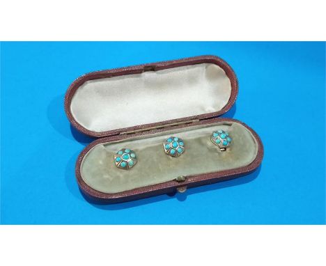 Three gold coloured opal mounted studs, in fitted leather case