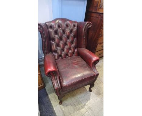 A good pair of Oxblood Chesterfield button back wing armchairs