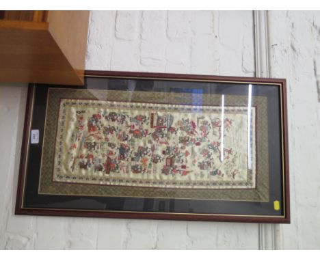 A Chinese silk embroidered panel depicting groups of children playing, 63cm x 30cm