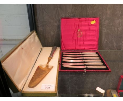 A French gilded cake slice in presentation case together with a cased set of silver handled tea knives