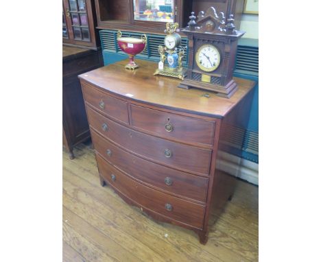 A Regency mahogany bowfront chest of drawers, with two short and three long graduated drawers on bracket feet, 92cm wide