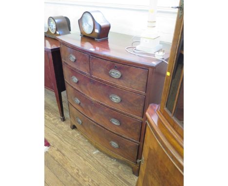 A Regency mahogany bowfront chest of drawers, with two short and three long graduated drawers on outsplayed bracket feet, 95c