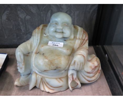 A large River Jade figure of Ho Tai or laughing Buddha, 16cm high