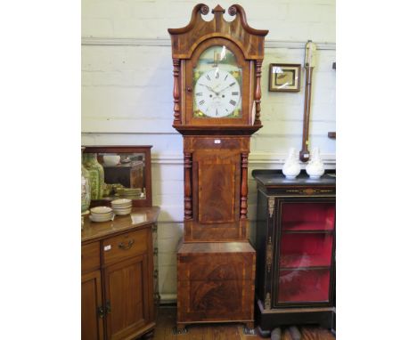 An early 19th century crossbanded mahogany broad longcase clock, the swan neck pediment on turned supports enclosing a painte