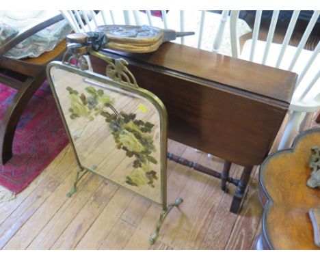 A walnut Sutherland table with turned supports, 65cm wide, a painted mirror firescreen and a pair of bellows