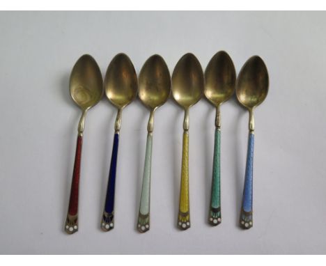 A set of six enamel coffee spoons, some enamel damage