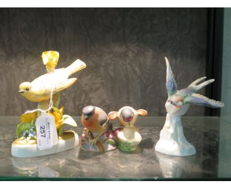 A Royal Worcester figure of a bullfinch, another of a goldfinch and two Crown Staffordshire figures of birds (4)