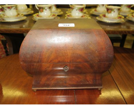 A Victorian mahogany tea caddy, of ogee rectangular form with brass ball feet and fitted interior (lacks inner containers) 22
