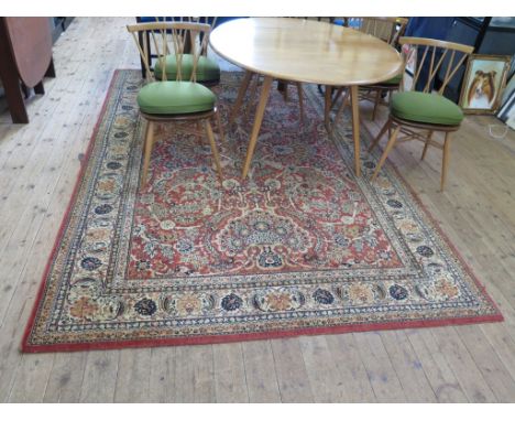 A Zeigler style carpet, the faded red field with all over foliate design and multiple border, 300cm x 200cm, a runner and thr