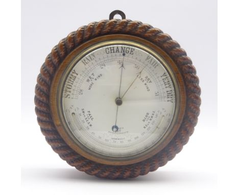 Late 19th century circular oak cased aneroid barometer in carved rope twist surround, curved mercury thermometer, D24cm