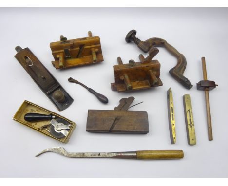 Collection of 19th century and later woodworking tools including brass bound moulding planes, Stanley smoothing plane, brace,