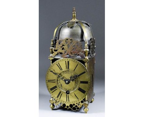 A 17th Century brass lantern clock, the 6.5ins diameter brass chapter ring with Roman numerals, later adapted and altered to 