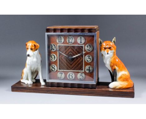 A rare pair of Royal Worcester seated models of a hound (Mode No.2994), and a seated fox (Model No.2993), both designed by Do