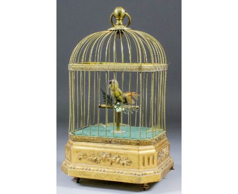 A German gilt metal and gilt wood "Singing Bird" automaton in cage, 6.5ins x 3.5ins x 11ins high