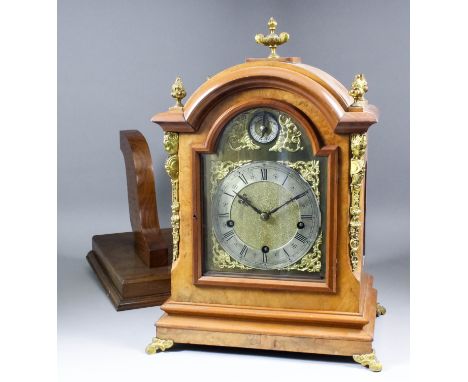 A late 19th Century German walnut cased bracket clock (rear plate marked Peerless  No. 77901) the 7.25ins arched brass dial w