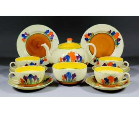 A Clarice Cliff "Bizarre" pottery "Crocus" pattern tea service, comprising - teapot and cover, 5ins high, milk jug, 3.25ins h