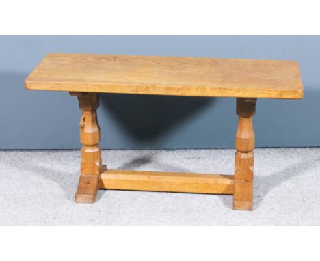 A 1960's  Robert "Mouseman" Thompson of Kilburn (1876-1955) oak rectangular coffee table, on octagonal turned end supports an